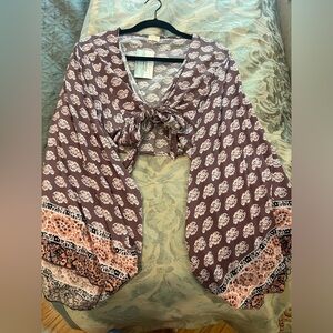 Long sleeve purple top with tie detailing and flowy sleeves